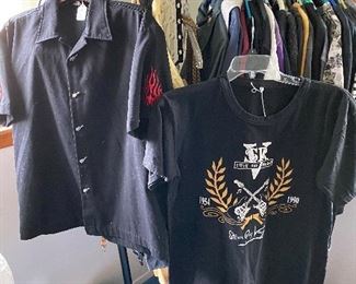 Shoes, Sandals, and Shirts! One shirt (on the left) has Guitar Buttons and flames on the sleeves! One t-shirt is a Stevie Ray Vaughn tribute T-shirt. Many T-shirts are music-themed. 