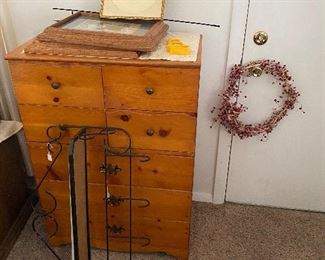 Vintage, wood dresser; wire shelf unit; assorted wall hangings; floral wreath, and more