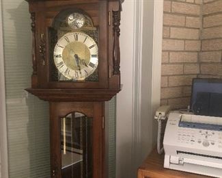Grandfather Clock. Fax machine is its neighbor.