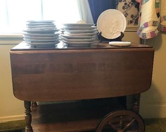 Tea cart loaded with Frankoma Christmas plates.