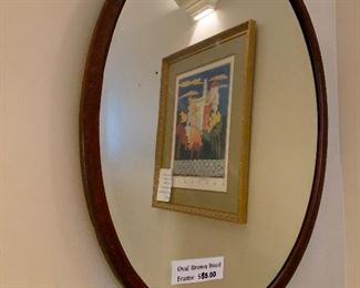 Oval wood mirror  beveled /brown wood frame  approx 42x32     $85.00