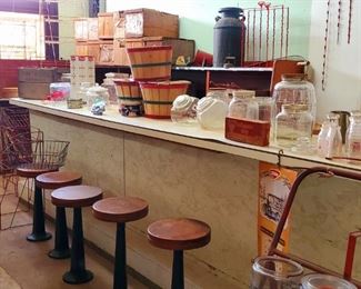 Vintage store counter, iron base wooden soda fountain stools, King Leo candy tin and baskets, candy jars, milk jars, Brach's candy display (new old stock), milk can, Tom's chip clips, and more!
