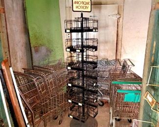 Vintage store buggys or shopping carts, hosiery spinning rack.