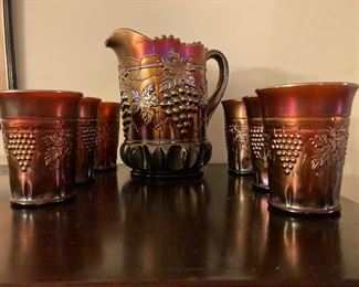 Carnival glass pitcher and 6 glasses