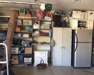 Storage cabinets and garage refrigerator.