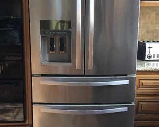 Like new, stainless Whirlpool 2 door, 2 drawer fridge/freezer.