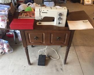 Bernina sewing machine, accessories and cabinet.