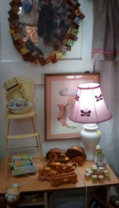 Roll high chair from yesteryear, wooden handcrafted toys,sweet picture and lamp to light up the room