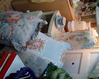 Sweet woven wicked bedside chest, fluffy pillows in Vintage fabric.