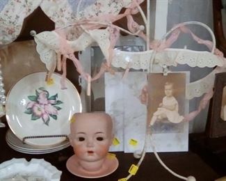 Ceramic doll head, glove display from the 1930-40s (found in the walls of the Toggery in Gonzales!