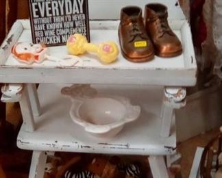 Old high chair with tray, bronze shoes, vintage rattles