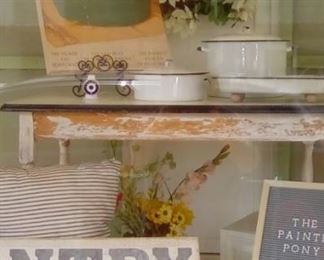 Love this front window filled with awesome finds. (All for sale except the screens and wreath.)