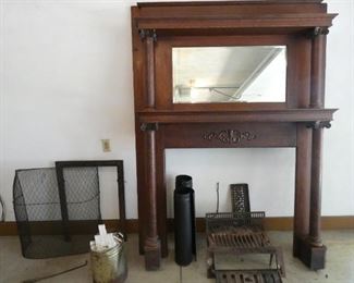 Fireplace mantle with cast iron grill, poker, screen and surround