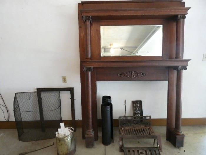 Fireplace mantle with cast iron grill, poker, screen and surround