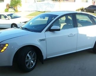 2008 Ford Taurus SEL available for pre-sale. Clean title/pink, 45,500 miles, always garaged, in excellent condition. Oxford white with sand tan interior, clean VIN check, current smog just completed Sept. 9th, cold AC recently serviced. dealer serviced every 2500 miles.