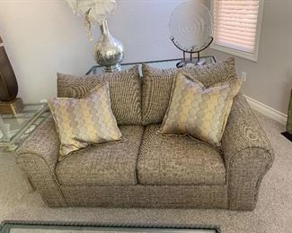 Multi tone tan loveseat
Table and decor behind couch is SOLD!