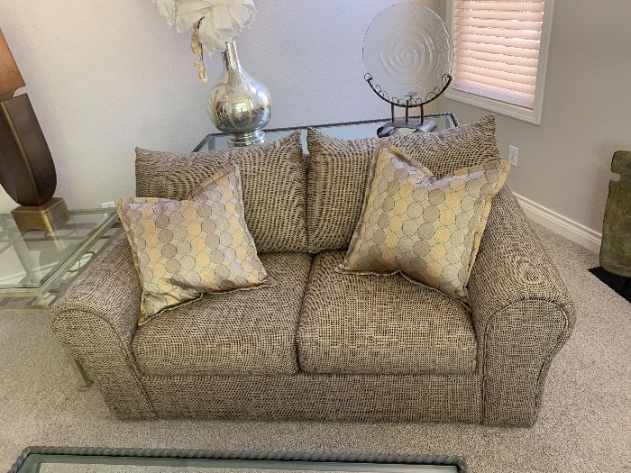 Multi tone tan loveseat
Table and decor behind couch is SOLD!