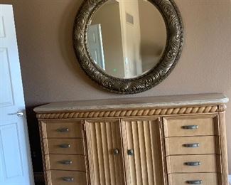 Dresser and large round mirror.