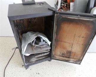 Smoker with door open....works great....includes cover