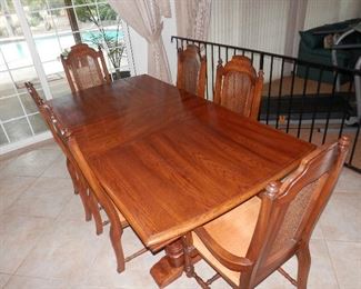 Huge oak dining table, 2 leaves, 2 arm chairs and 6 side chairs....this is NOT the crap available to buy today at furniture stores!  Call (760) 975-5483