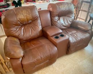 Leather reclining loveseat with center console