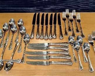 Item 59:  Waterford Silverware:  $95                                                                                   12 knives, 11 soup spoons, 7 teaspoons, 5 dinner forks, 4 salad forks