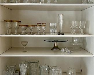 Assorted glassware, vases, cake stands, etc.  All priced at the sale!