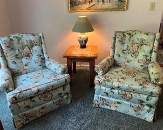 Custom upholstered skirted armchairs 