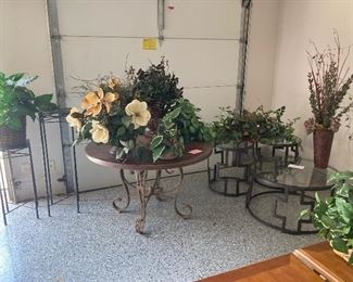 Assorted tables and decorative greenery