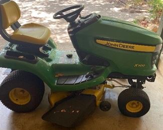 John Deere Lawnmower. Large attachments available 
