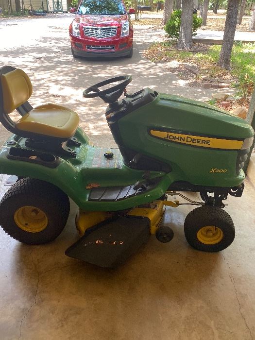 John Deere Lawnmower. Large attachments available 