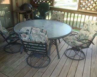 Patio table with 4 swivel rocking chairs
