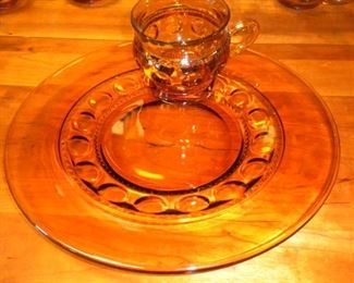 Thumbprint Depression Design Amber Glass Festive Plate which includes Cup holder, and Matching Cup. 1 set of 20 $225 or each set of 10 $125.  