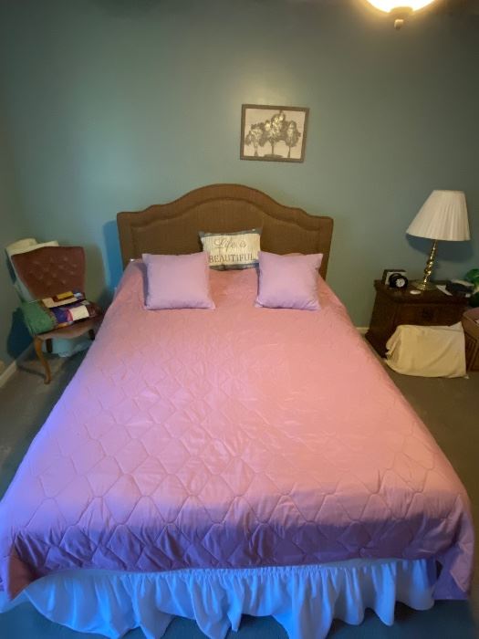Brand new queen bed with mattress and box spring in protective covers