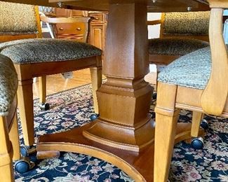 Thomasville Cherry 46" Round Pedestal Table with 4 Armed Chairs on Casters.  Expands (As Shown with 18" Leaf) to 64" Oval Table