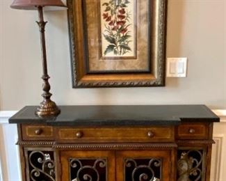 Beautiful Console with Wrought Iron Details on Doors and entire piece is wrapped in authentic leather with Stone top.  Cabinets open and 3 drawers  