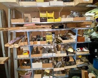 One of MANY shelves with clock parts 