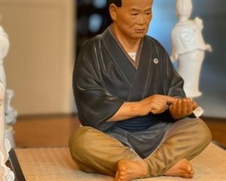 Vintage Hakata Urasaki Pottery Doll with Faux Grass Mat