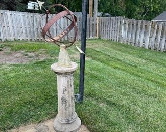 Metal Arrow Sphere on Concrete Column Base