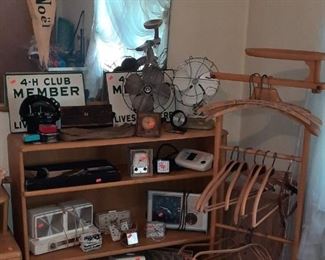Vintage fans, clocks and hangers from St. Joseph. Heywood Wakefield bookshelf.