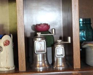 There are many salt and pepper shakers and grinders here!