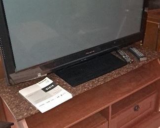 52” TV attached to cabinet 