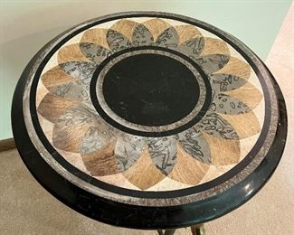 Gorgeous French Empire Style Bronze Swan and Tesselated Mosaic Stone Guerdion Table. Wow! Gorgeous triple swan guerdon accented with talon legs clutching ball feet.  Circa 1970's. Measures about 26" h x 22.5" w. Some light fading on the top surface likely from sun exposure. Comes with a glass protective cover.