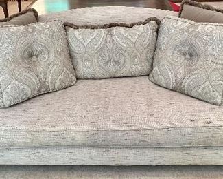 Tommy Bahama Sofa in a lovely neutral shade and paired with beautiful accent pillows. A very faint stain on the front which is not overly noticeable. 

Measures 7' x 34". The winning bidder is responsible for removal. Employees are not able to provide lifting or moving assistance. 
