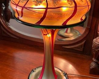 Beautiful Carl Radke Graceful Art Glass Luster Table Lamp with a lovely cherry blossom design. Hand blown by renowned artist, Carl Radke. 

Number of bulbs; 3 (2-40watt). In working condition. Measures about 19.5" h and the base at 8".  Signed on the bottom. 