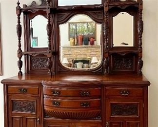 Gorgeous Antique English Edwardian Mahogany Sideboard with Carved Detailed Designs. Circa 1890-early 1900's. Truly a masterpiece! The details and design are stunning! 

Measures about 71" l x 23" deep x 96" h. 