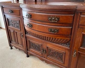 Gorgeous Antique English Edwardian Mahogany Sideboard with Carved Detailed Designs. Circa 1890-early 1900's. Truly a masterpiece! The details and design are stunning! 

Measures about 71" l x 23" deep x 96" h. 