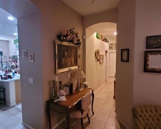 Hall desk and padded chair.