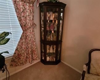 Wood/glass curio with variety of glass and porcelain figurines.