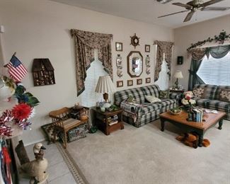 Family room sofa, love seat, coffee table, lamp tables and antique bench.